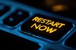 © Abdul - Illuminated Restart Button on a Dark Workspace with Dramatic Lighting Emphasizing a Key in a Modern Digital Environment
