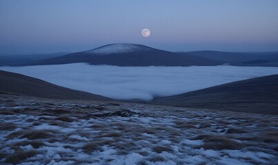 Wall Mural - Moonlit landscape with snow-covered hills and valley fog.