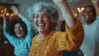 © Frank Gärtner - Multi-ethnic group of senior women raising arms and laughing together during a joyful moment