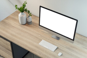 Wall Mural - Minimal workspace with desktop computer, blank screen, and keyboard on a wooden desk with decorative vases, modern office design. 3D Rendering