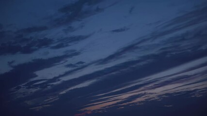 Fototapete - Colorful sunset sky with vibrant clouds and warm hues in evening tranquility