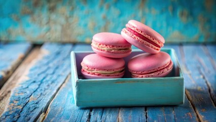 Wall Mural - Pink Macarons in a Blue Wooden Box on a Weathered Blue Tabletop