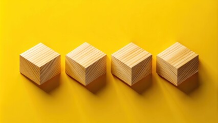 Aufkleber - Four wooden blocks on a yellow background, a simple geometric arrangement highlighting texture and shape.