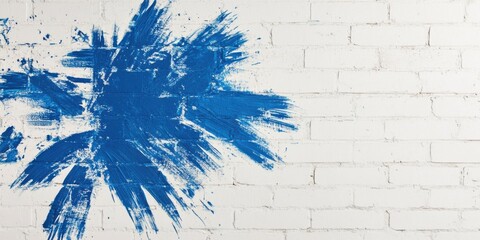 This is an Artistic Abstract Blue Paint Splash Effect on a Textured White Brick Wall Background