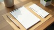 © Александр Бердюгин - A minimalist workspace with a blank notepad, pencil, envelopes, and a plant on a wooden desk under soft sunlight
