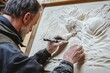 © Dream maker - Crafting intricate sculptures with skilled hands in a workshop setting during daylight
