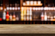 © Agil - wooden table for placing products with a beautiful night restaurant backdrop, Space for placing items on the table, product and food display.