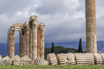 ruins of ancient structure with fallen column on an overcast day