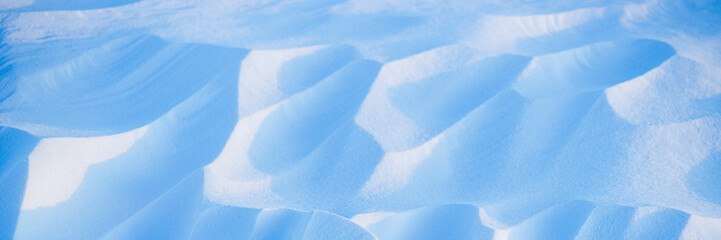 Wall Mural - snow texture. wind sculpted patterns on snow surface. wind in the tundra and in the mountains on the