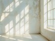 © Luisa - Sunlit empty room with white walls and windows that let in light, casting natural light shadows.