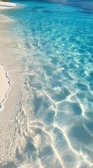 Wall Mural - Beautiful tropical beach with clear blue water and soft white sand. The reflections in the water create a tranquil scene perfect for relaxation or vacation dreams.