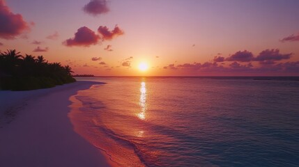 Wall Mural - A breathtaking sunset over a calm beach, with soft waves and a colorful sky. The sun sets beautifully, casting warm reflections on the tranquil water.