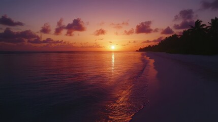 Wall Mural - Stunning sunset over calm waters at a tropical beach, with gentle waves and soft sands, creating a perfect serene atmosphere for relaxation and peace.