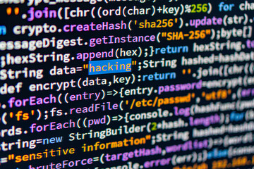 close-up view of multi-colored computer code on a light gray background, indicative of programming l