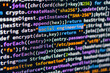 © Mister - Social engineering. Image shows a close-up of C code highlighting social engineering, situated in a workspace on a laptop screen The code is structured and vibrant with varying shades of blue, purple