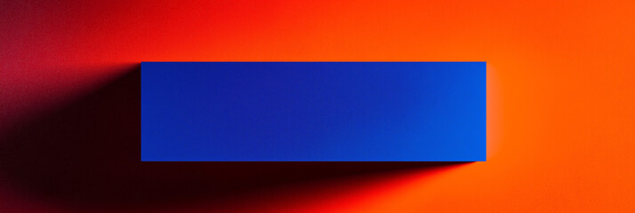 Fototapete - Blue rectangular prism casting shadow on orange surface