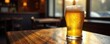 © photohappy - Frosty beer glass on worn pub table, sunlight dappled , still-life, afternoon