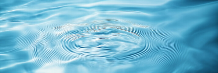 Leinwandbilder - Circular ripples expanding on clear blue water surface