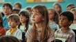 © phy - A classroom full of kids listening closely to their teacher as she explains a lesson.
