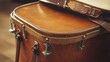 © Mega - Close-up of vintage wooden drum with leather top and straps.