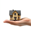 © Anuson - hand holding house on white