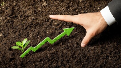 Canvas Print - Hand guiding growth arrow next to a seedling in soil.