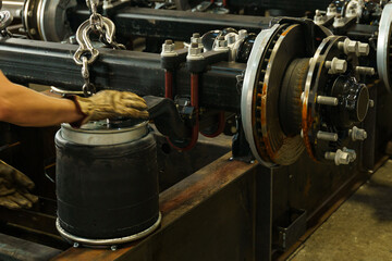 Fototapete - Mechanical hands expertly install a component in a robust workshop setting