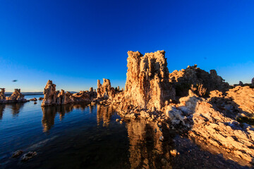 Sticker - A rocky shoreline with a body of water in the background