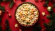 Chicken potpie topped with pastry stars, isolated on a festive holiday-themed background with red and green accents