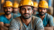© Bolbik - Portrait of factory workers in safety gear, including helmets and glasses, standing in an industrial environment, showcasing teamwork and safety
