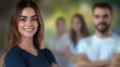 © heinng - Close-up Photo: Confident Woman Smiles, Teammates Blurred in Background. AI Generated