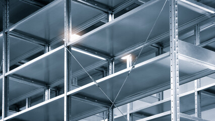 Fototapete - Interior of the new and modern empty shelves warehouse space