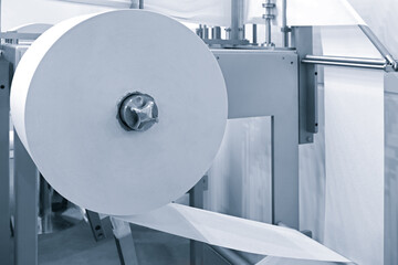 Poster - Process of various paper products manufacturing indoors, paper roll on a packaging conveyor