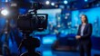 © Ivan - In a dynamic news studio, a camera is positioned in the foreground, focusing on a presenter in the background, with bright lights and screens illuminating the space