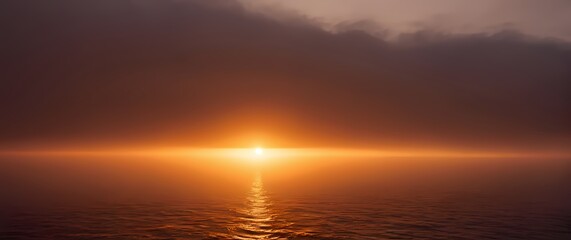 Fototapete - A breathtaking view of a sunset over a calm sea where the sky is painted in warm hues
