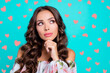 © deagreez - Close up portrait of lovely, sweet, gorgeous, adorable curly brunette look aside, touch chin by hand isolated on bright turquoise background