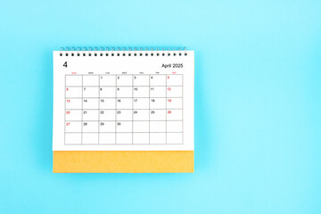 Wall Mural - Aril 2025, Monthly desk calendar for 2025 year on blue background.