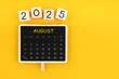 © gamjai - Calendar for August 2025 in black chalkboard with copy space.