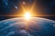 © ABDA - A breathtaking sunrise over Earth seen from space, with a glowing sun casting a warm light on the planet. The dark background of space is filled with stars.