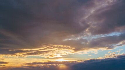 Wall Mural - 4k clouds and sunlight natural landscape at sunset.colorful sky cloud natural background.4k time lap