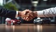 © Nice Seven - Business handshake between two people in formal attire, showcasing successful deal in dealership environment with toy cars in foreground