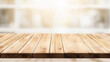 © Tossakan Photos - Empty wooden table with blurred supermarket background. Concept for displaying products.