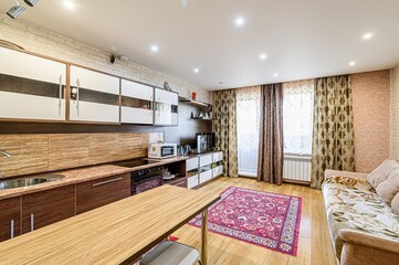 interior apartment kitchen and dining room, refectory area, cooking equipment, table furniture, stove