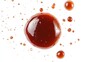 © Elkhan Babayev - BBQ sauce or ketchup drop isolated on a white background, close-up and top view.