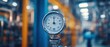 © batara - Close-up of industrial thermometer gauge in factory.