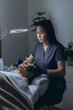 © Екатерина Лукашина - Middle aged woman receiving facial cleansing and care at a cosmetologist office