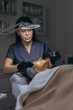 © Екатерина Лукашина - Middle aged woman getting anti aging facial peeling treatment at a cosmetic clinic