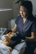 © Екатерина Лукашина - Middle aged woman receiving facial cleansing and care at a cosmetologist office