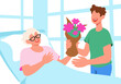 © Westend61 - Man giving bouquet to grandmother lying on bed at hospital