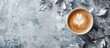 © CreativeBro - Cozy winter flat lay with coffee drink and metallic silver leaves on textured background perfect for seasonal themes and promotional content